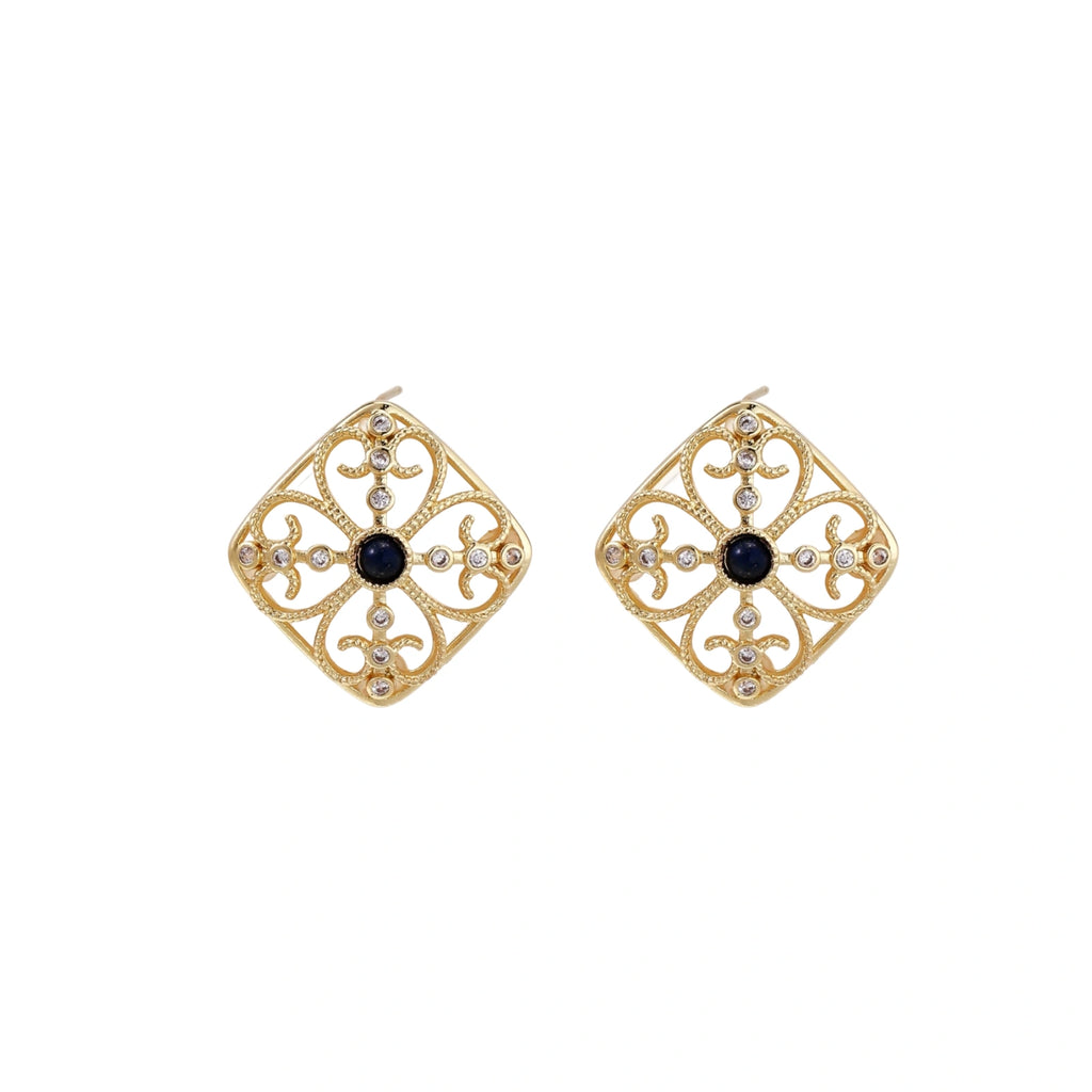 Gold filigree stud earrings with navy lapis lazuli center stone and mother-of-pearl accents in ornate quatrefoil design
