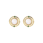 Circular gold stud earrings with iridescent mother-of-pearl center and green zirconia accents on cream background.