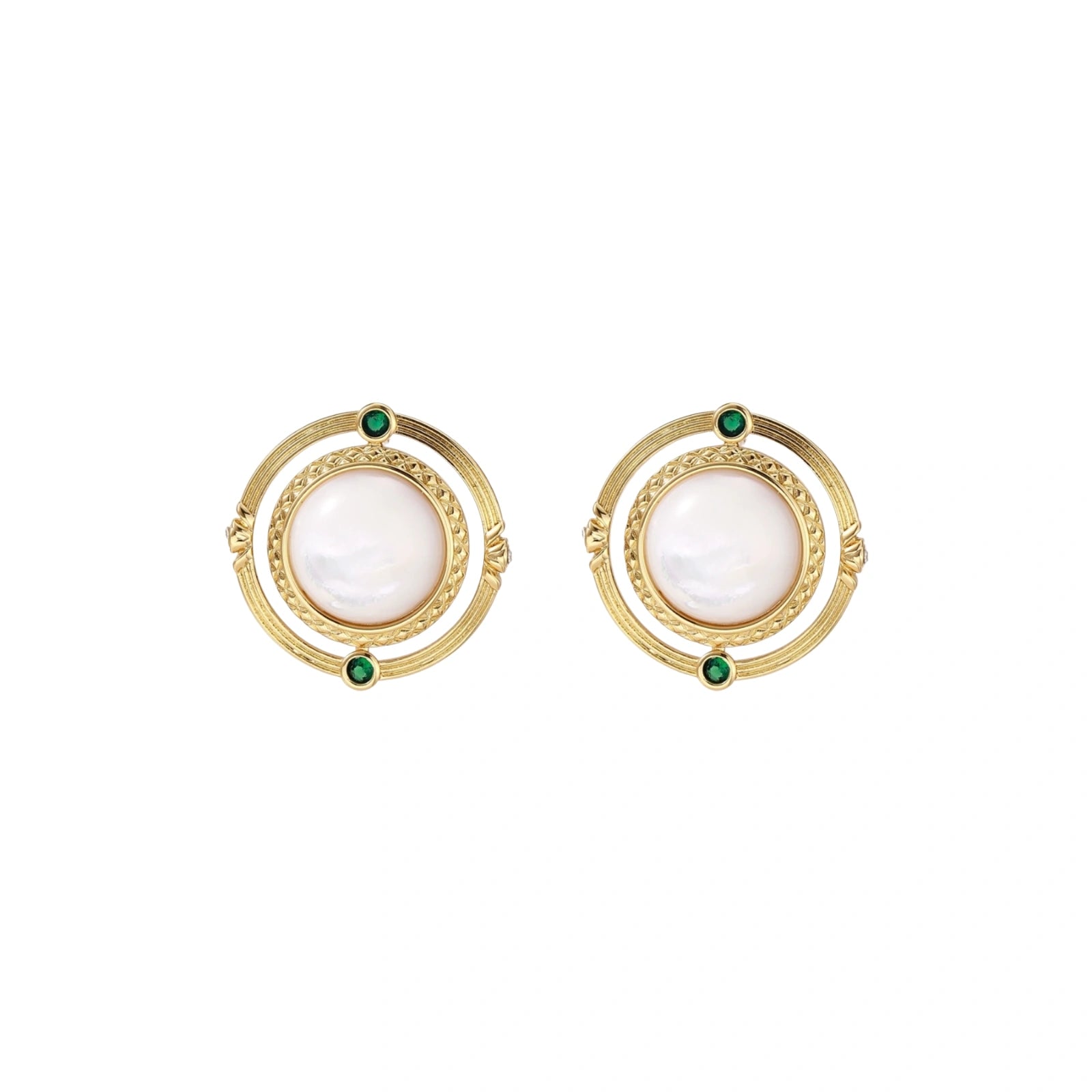 Circular gold stud earrings with iridescent mother-of-pearl center and green zirconia accents on cream background.