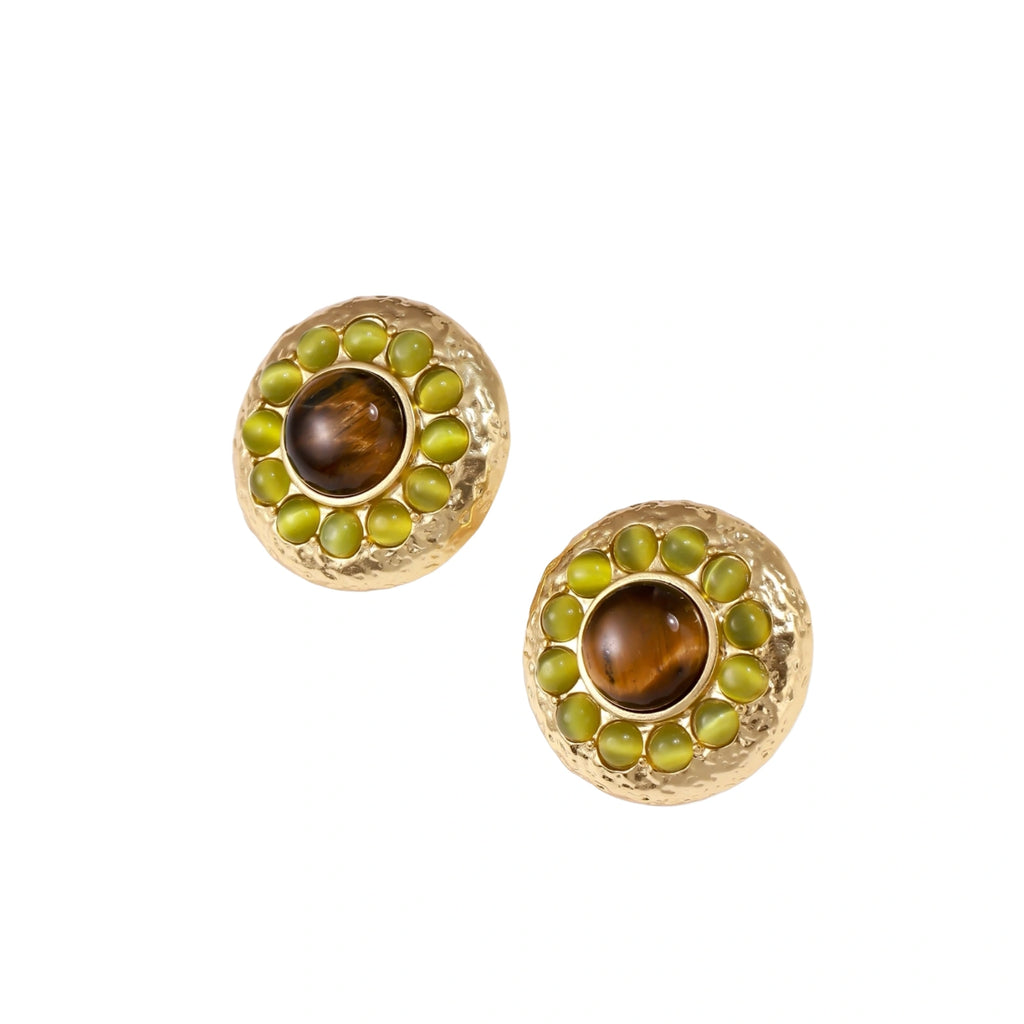 Round hammered gold studs with brown tiger's eye center surrounded by olive green liuli stones on white background.