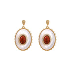 Gold-plated drop earrings with layered oval mother-of-pearl and cognac gemstone center framed by crystal halo