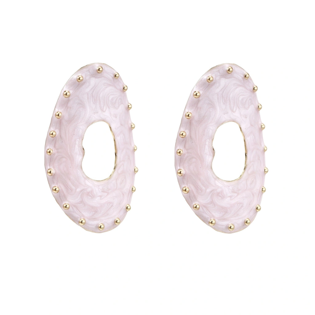Oval lavender enamel earrings with marbled finish and gold-plated beaded border on cream background.