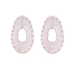 Oval lavender enamel earrings with marbled finish and gold-plated beaded border on cream background.