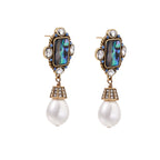 Ornate gold-plated drop earrings with rectangular abalone shell centers, crystal accents, and baroque pearl drops