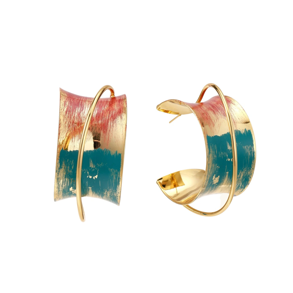 Gold-plated hoop earrings with teal and coral enamel brushstroke design on cream background