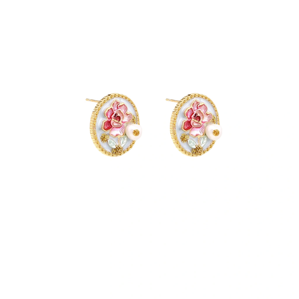 Gold-rimmed circular stud earrings with hand-painted pink peony enamel and pearl accents on white background