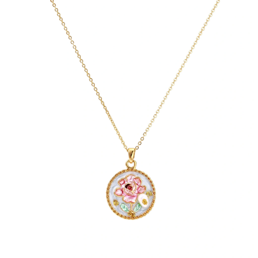 Gold-plated circular pendant with pink enamel rose, pearl background, and delicate beaded border on chain