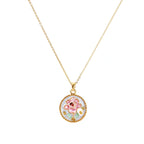 Gold-plated circular pendant with pink enamel rose, pearl background, and delicate beaded border on chain
