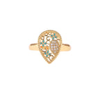 Teardrop-shaped gold-plated ring with turquoise enamel flowers and crystal pavé detail on cream background