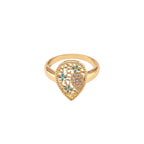 Teardrop-shaped gold-plated ring with turquoise enamel flowers and crystal pavé detail on cream background
