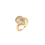 Teardrop-shaped gold-plated ring with turquoise enamel flowers and crystal pavé detail on cream background
