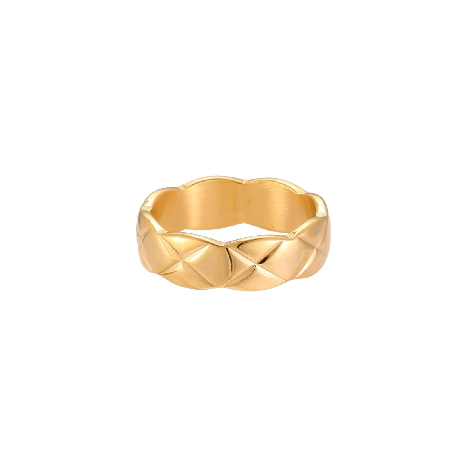 Close-up of an 18K gold-plated twisted band ring with dimensional braided pattern on cream background.