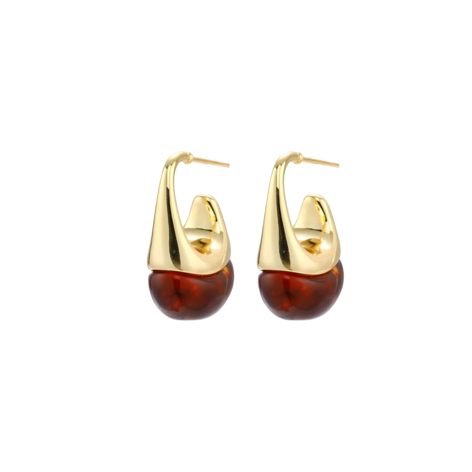 Modern drop earrings with curved gold-plated copper tops and amber resin bottoms creating an organic teardrop silhouette.