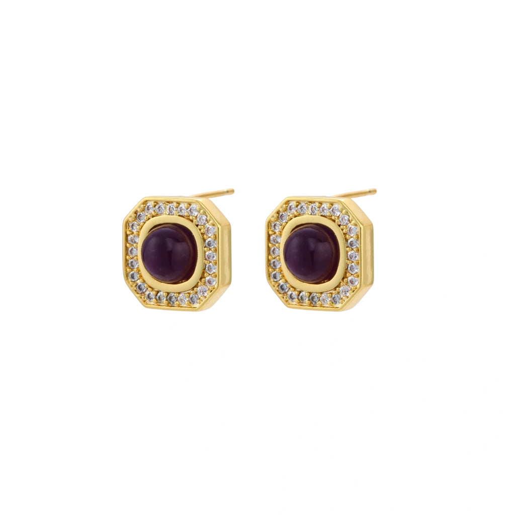 Gold-plated octagonal stud earrings with burgundy liuli centers and cubic zirconia halos on white background