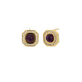 Gold-plated octagonal stud earrings with burgundy liuli centers and cubic zirconia halos on white background
