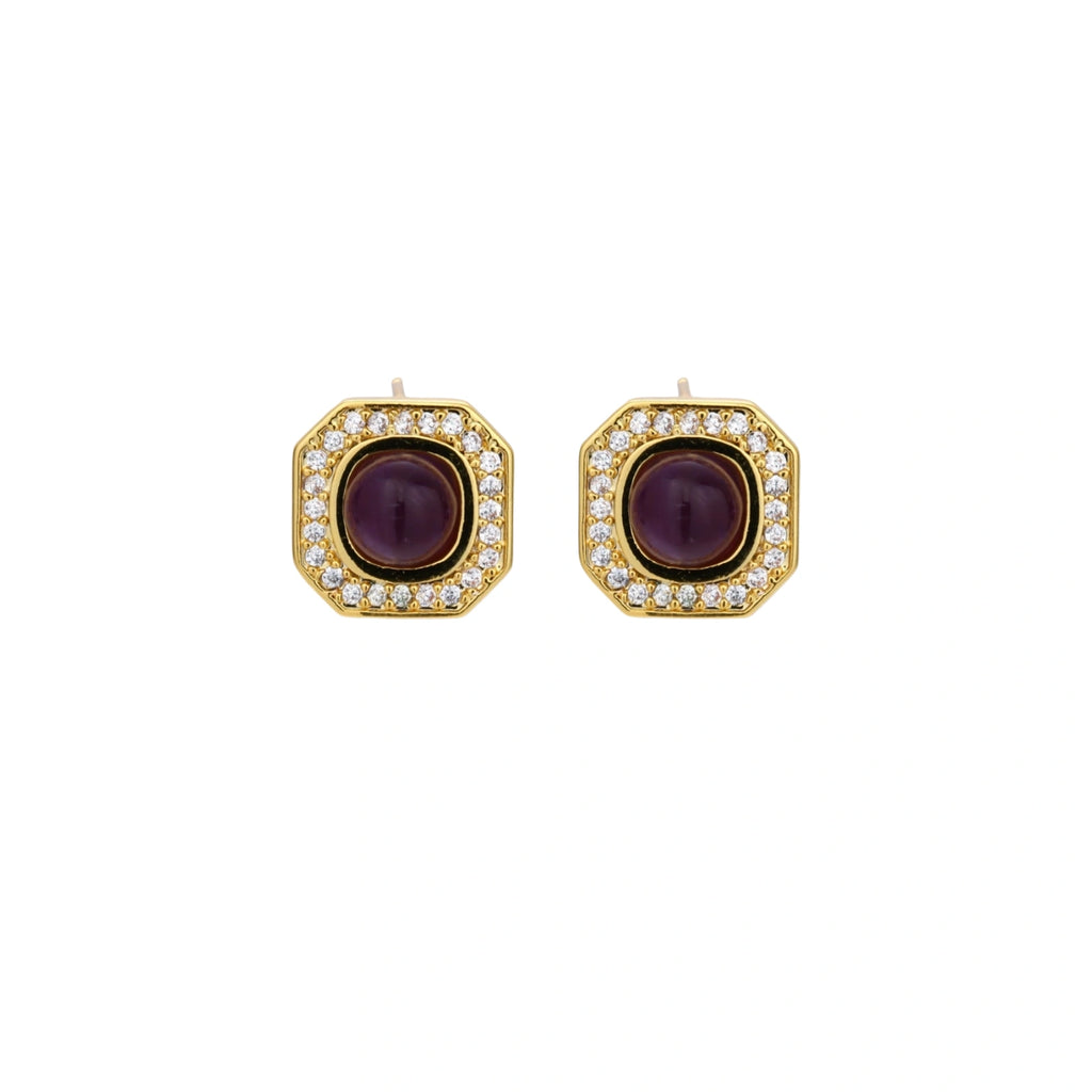 Gold-plated octagonal stud earrings with burgundy liuli centers and cubic zirconia halos on white background
