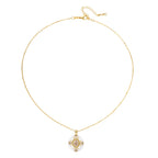 Gold-plated necklace with circular white enamel pendant featuring central zirconia stone and ornate decorative details