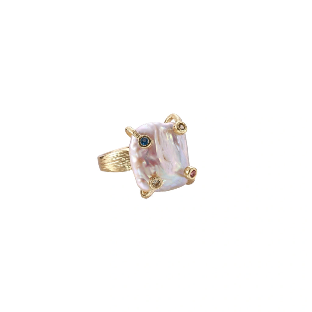 Gold ring with large iridescent baroque pearl and four colored gemstones on textured band