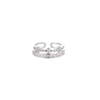 Silver-toned adjustable crown ring with channel-set square zirconia stones and delicate floral details on white background