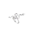 Sculptural white gold-plated snake ring with crystal accents coiling around finger in bold open design