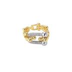 Triple-band gold ring with spherical bead chains and two crystal-pavé bars on cream background
