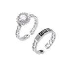 Two adjustable white gold plated rings with chain-link bands, featuring cubic zirconia halo and enamel details