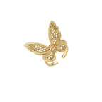Intricate gold-plated butterfly ring with filigree cutout wings and adjustable band on white background.
