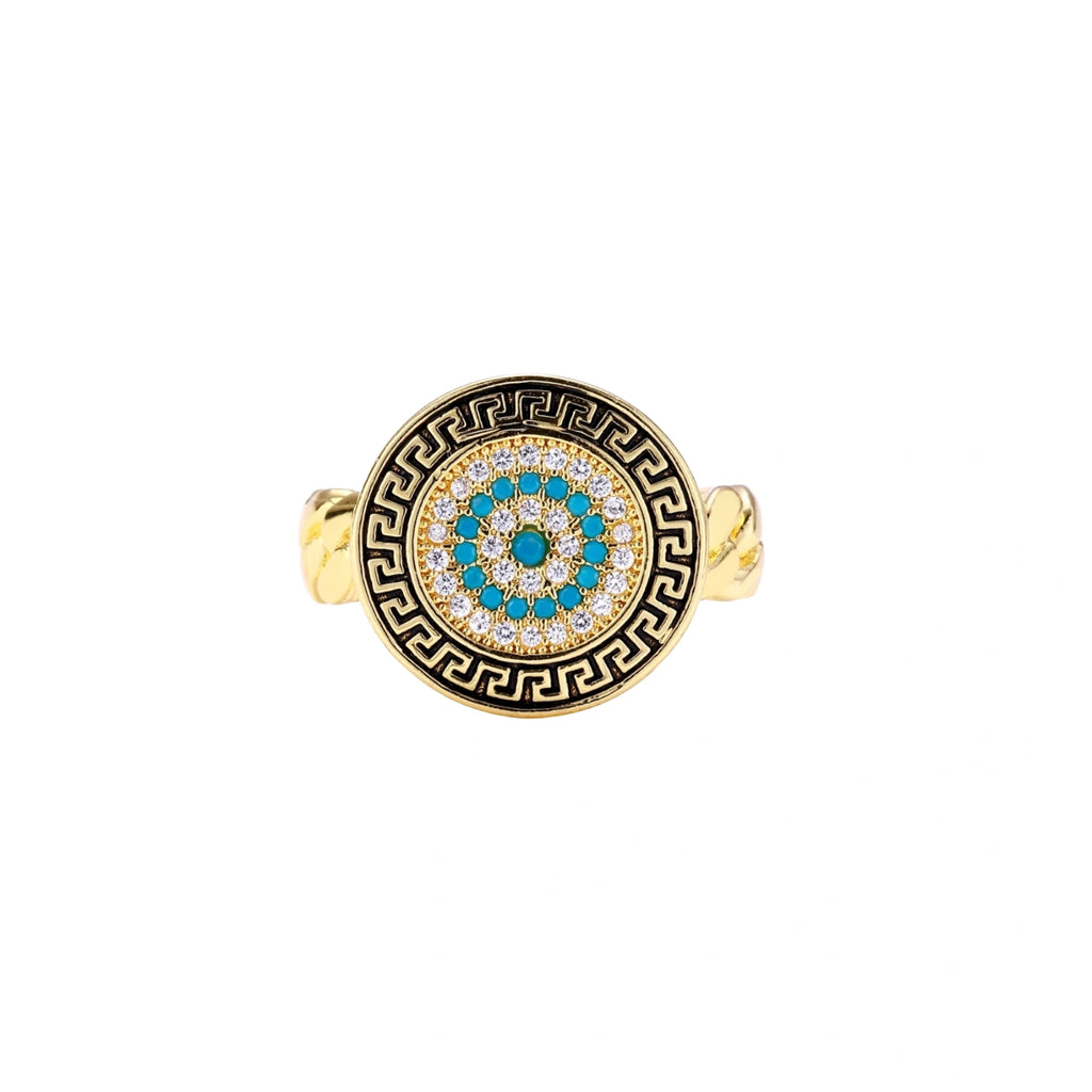 Gold chain ring with Greek key border and turquoise evil eye center on white background