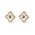 Gold-plated jewelry set with diamond-shaped pendants featuring white centers, green stones, and sparkling zirconia borders