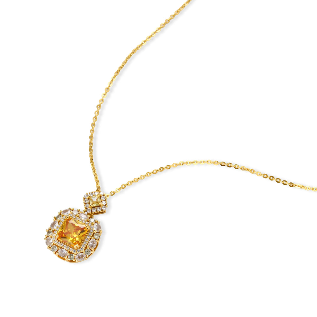 14K gold-plated jewelry set featuring square-cut cubic zirconia stones in ornate layered settings on white background.